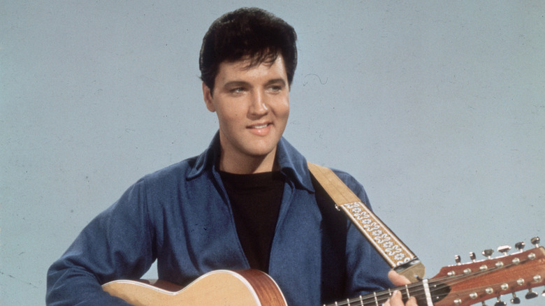 Elvis Presley playing guitar