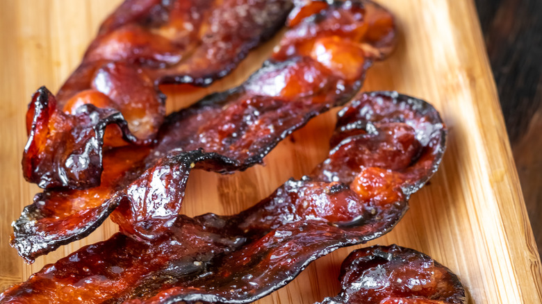 Glazed bacon on cutting board
