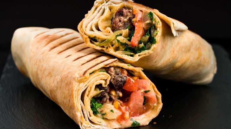 Presentation of two shawarma wraps 