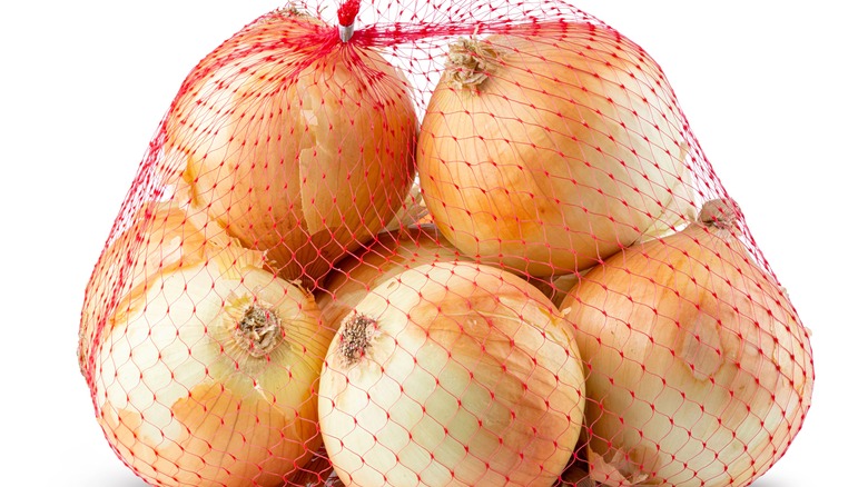 Yellow onions in a mesh bag