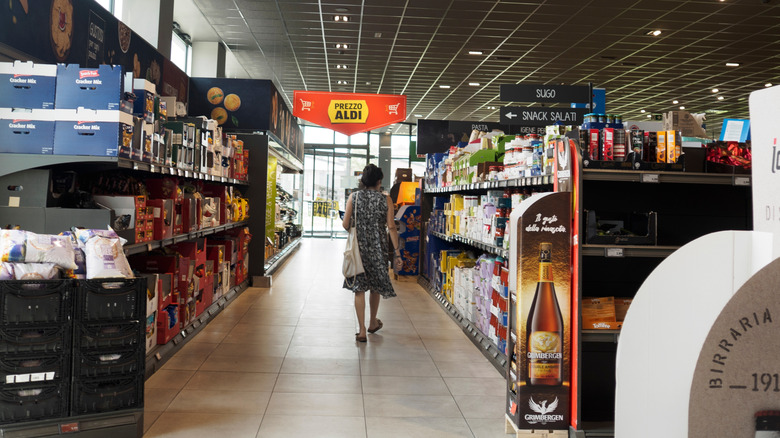 Woman shopping at an Aldi in Italy during off-peak hours