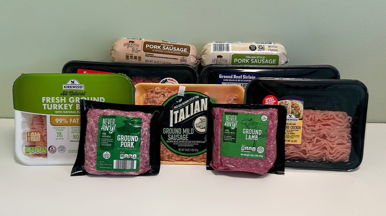 Several Aldi meats together against a green and white background
