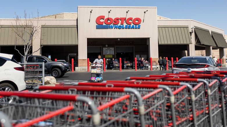 Image of Costco store with carts in foreground