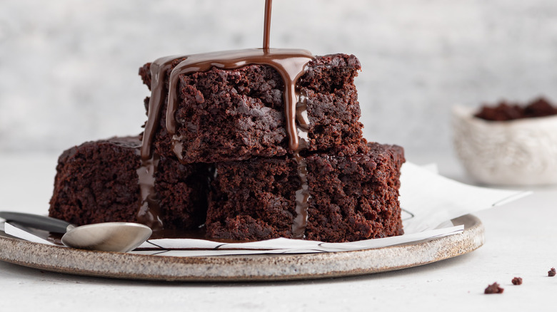 Melted chocolate drizzled on brownies