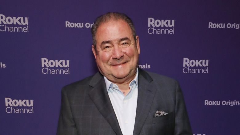 Emeril Lagasse smiling on the red carpet at a Roku Channel event