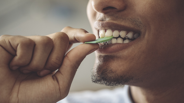 man chewing gum