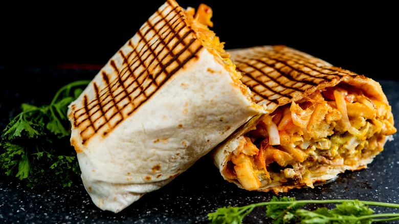 French tacos surrounded by herbs