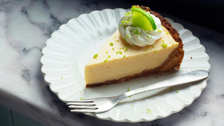 slice of key lime pie on plate