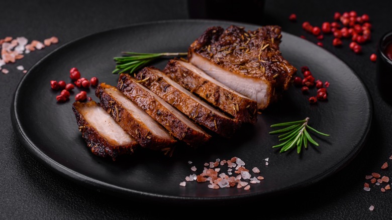 sliced pork chop on a plate