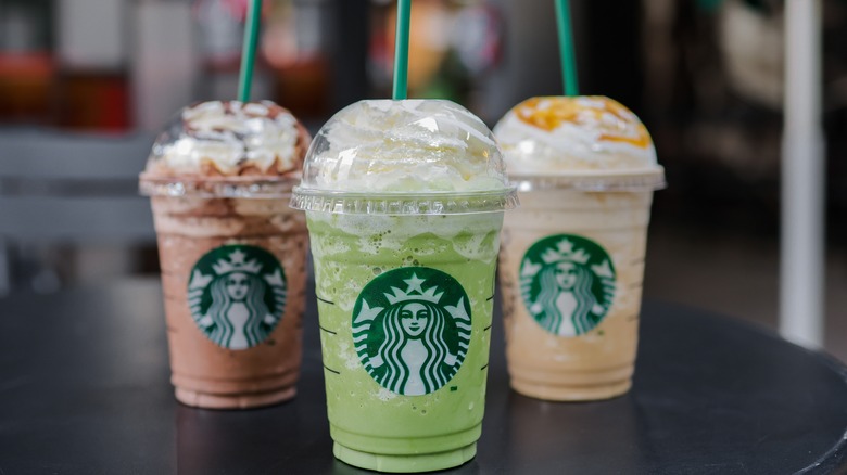 Three Starbucks drinks on table 