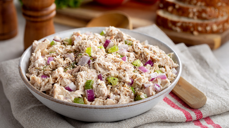 tuna salad in a bowl on a dishcloth