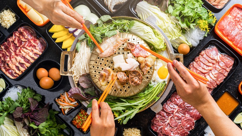 grilling meat on korean barbecue tabletop grill