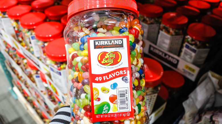 A close-up of Costco's Kirkland Signature Jelly Belly candies in a large plastic jug