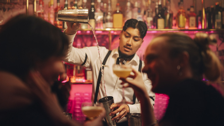 Bartender pouring drink