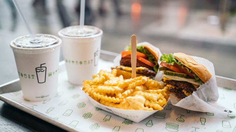 Shake Shack order with burgers, fries, and drinks