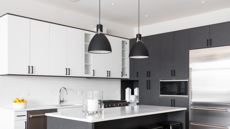 Black-and-white kitchen with space above upper cabinets