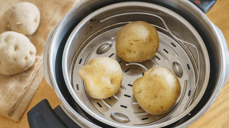 Whole potatoes in a pressure cooker.