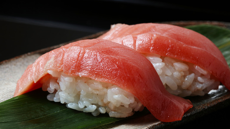 Tuna nigiri on a plate.