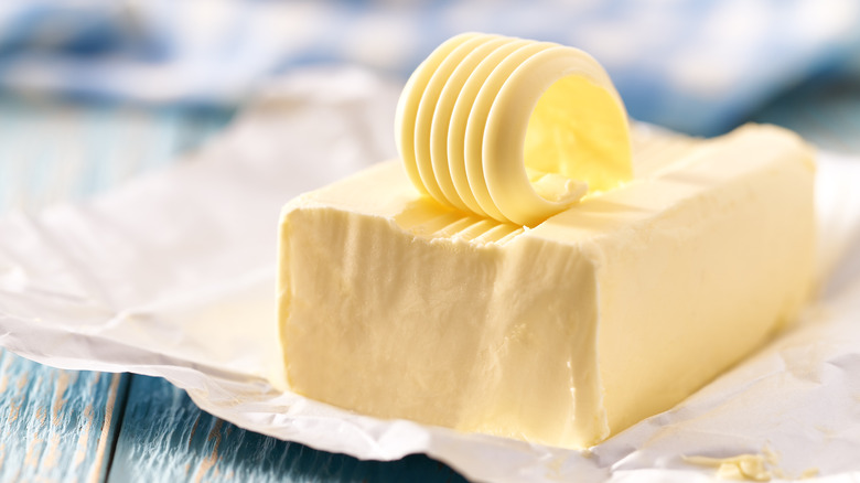 Piece of butter on a wooden table