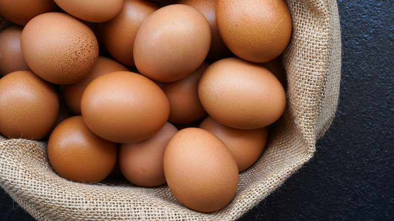 brown eggs in burlap bowl