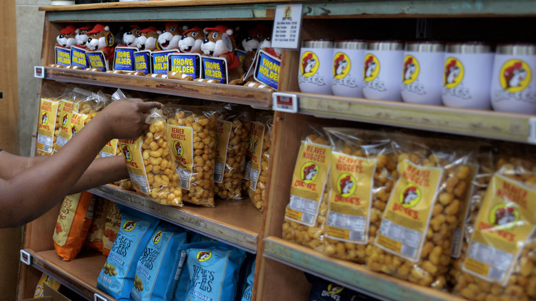 Someone restocking Buc-ee's shelves