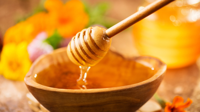 Bowl of honey and honey wand