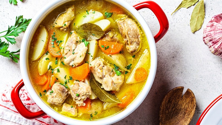 Pot of soup with bay leaves