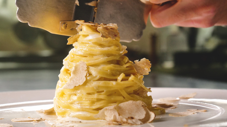 Pasta topped with white truffle mushrooms