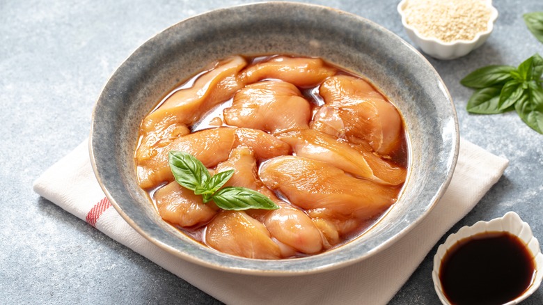 Chicken in a bowl in marinade