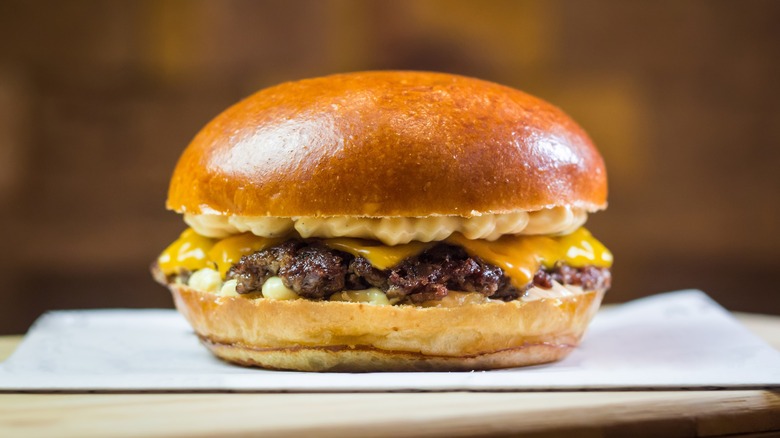 smash burger on wooden table