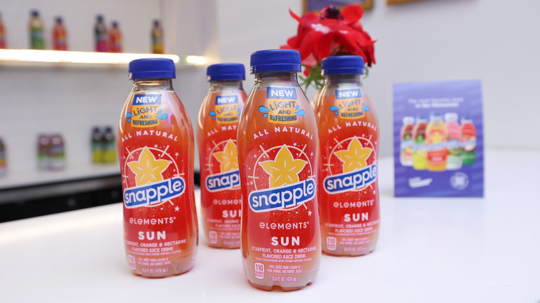 Line of Snapple Elements Sun bottles on a table