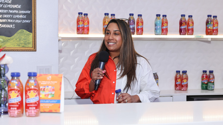 Snapple Elements surrounding woman with microphone