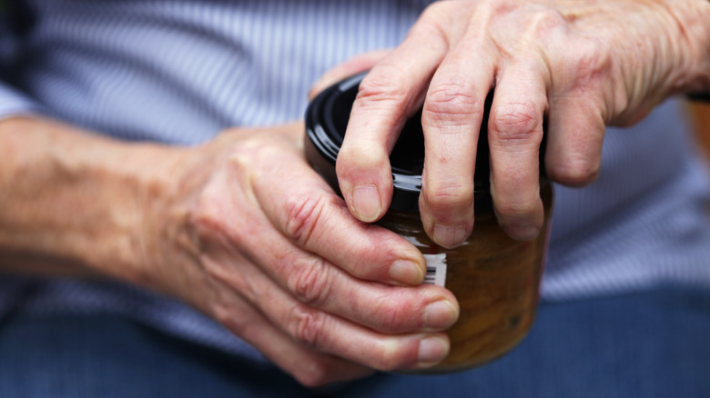 Man opening jar