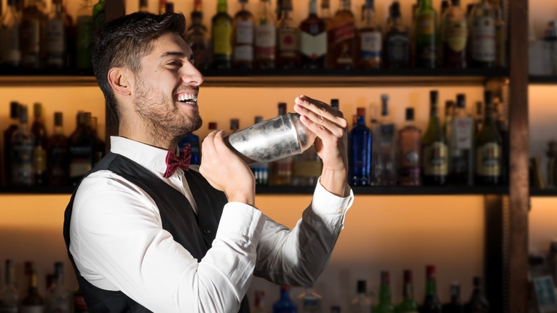 Bartender shaking drink