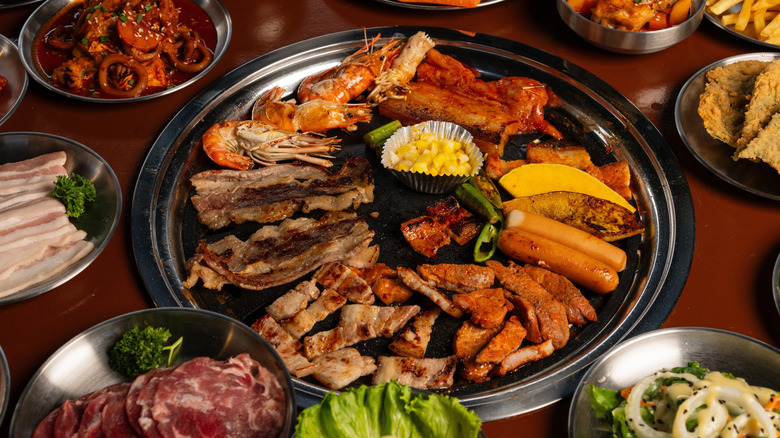 Meat and shrimp on Korean BBQ grill