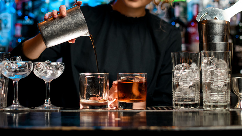 Pouring drinks over clear ice
