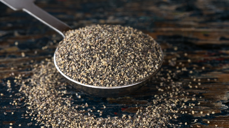 Spoon of black pepper