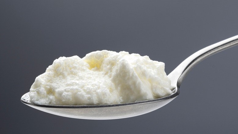 Curdled cream in spoon 