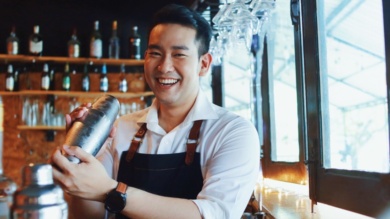 Man shaking cocktail