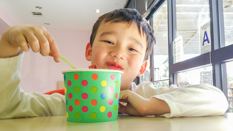Kid eating frozen yogurt