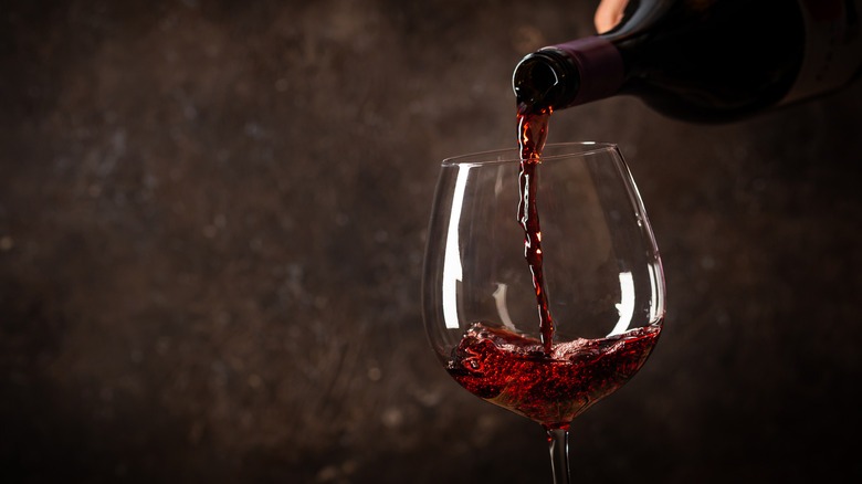 Pouring a glass of red wine