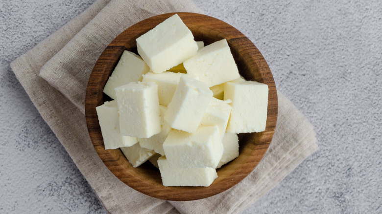 paneer cubes in wooden bowl