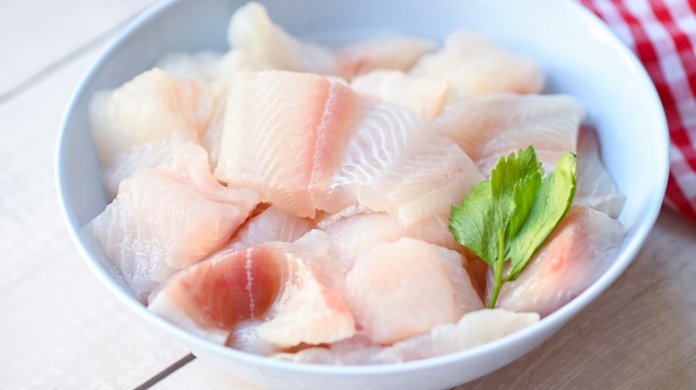 Raw white fish in a bowl
