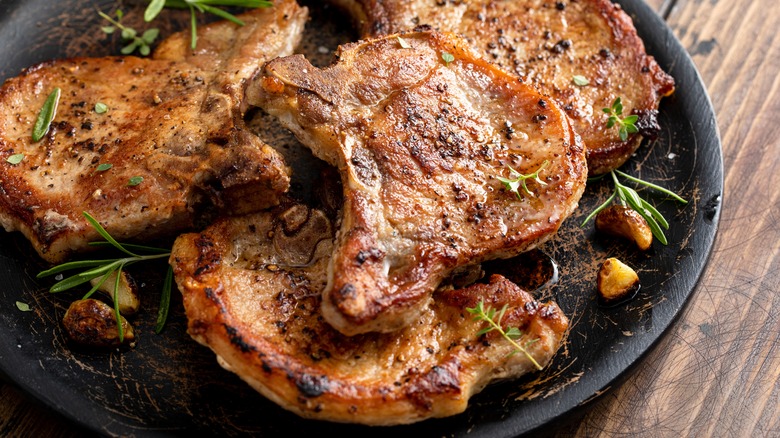 browned pork chops on plate