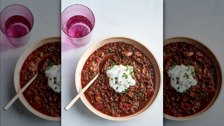 bowl of chili topped with sour cream