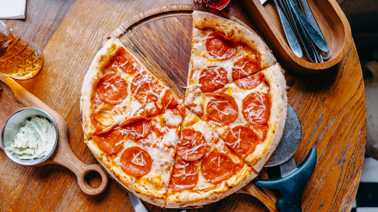 Pepperoni pizza on table.