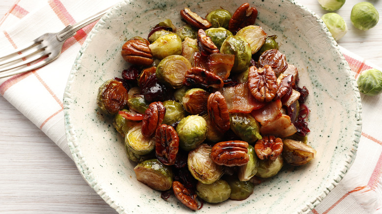overhead shot of roasted Brussels sprouts with pecans and bacon