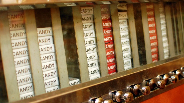 Candy cigarette boxes in an old-fashioned-style cigarette vending machine