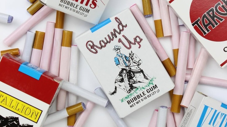 Boxes and loose pieces of candy and bubble gum cigarettes