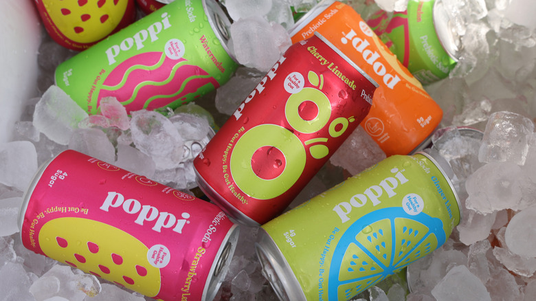 Poppi cans in a cooler with ice